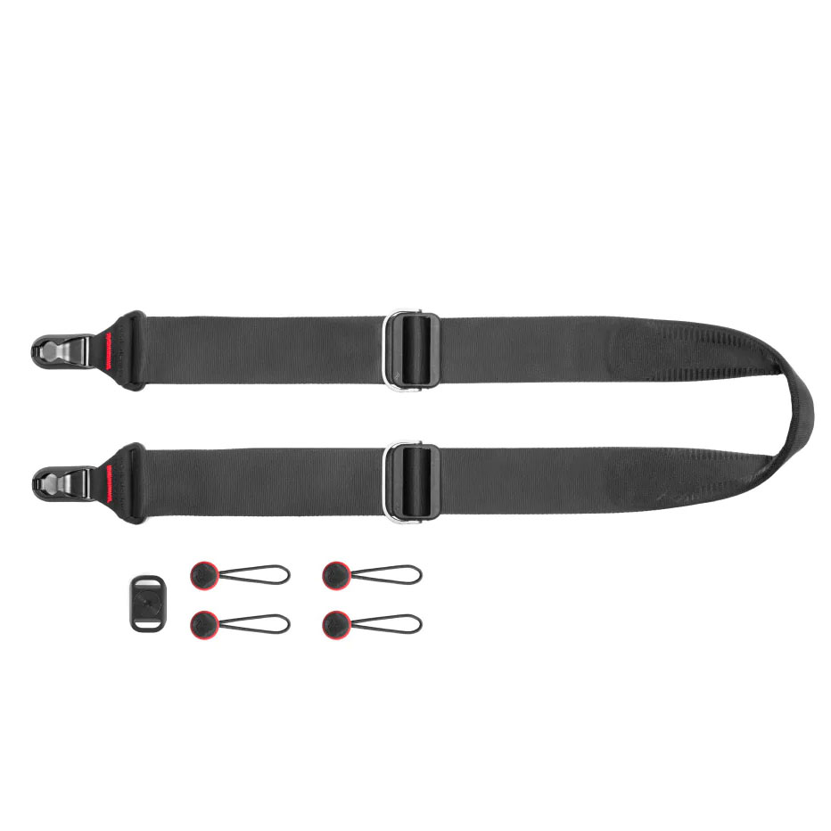 Peak Design Slide camera strap on a white background next to anchor accessories. 