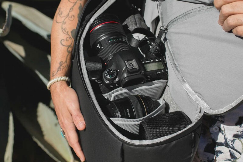 The Peak Design Everyday Backpack open with camera gear inside.
