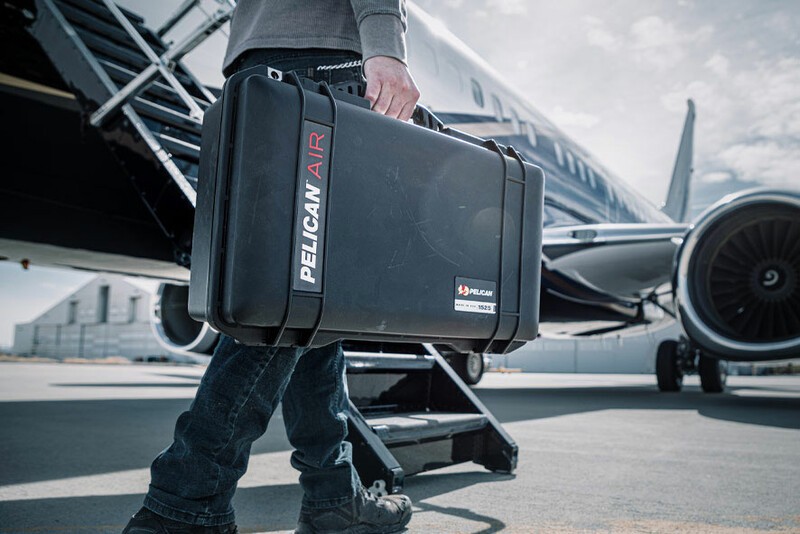 The Pelican Air Carry Case being carried to an airplane. 
