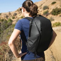 A woman wearing the Peak Design Everyday Backpack Zip while hiking.