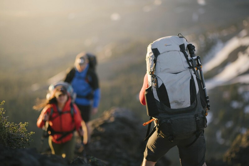 Lowepro PhotoSport Backpack PRO being worn by a man on a mountain. 