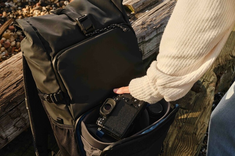 Tenba DNA backpack being open on a park bench.