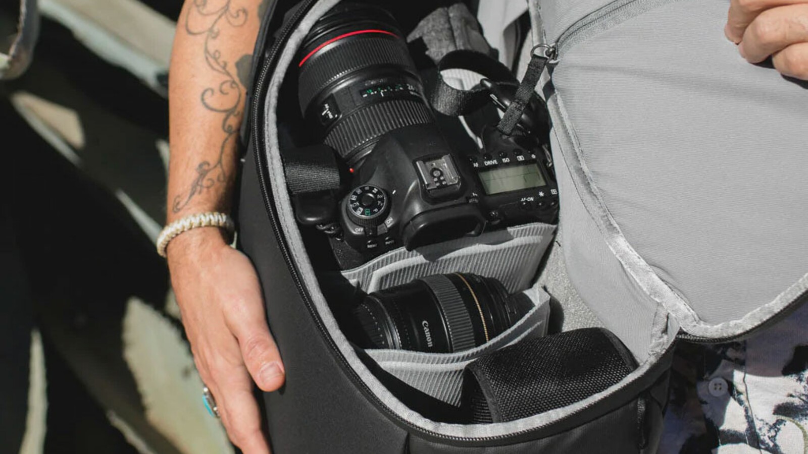 The Peak Design Everyday Backpack open with camera gear inside.